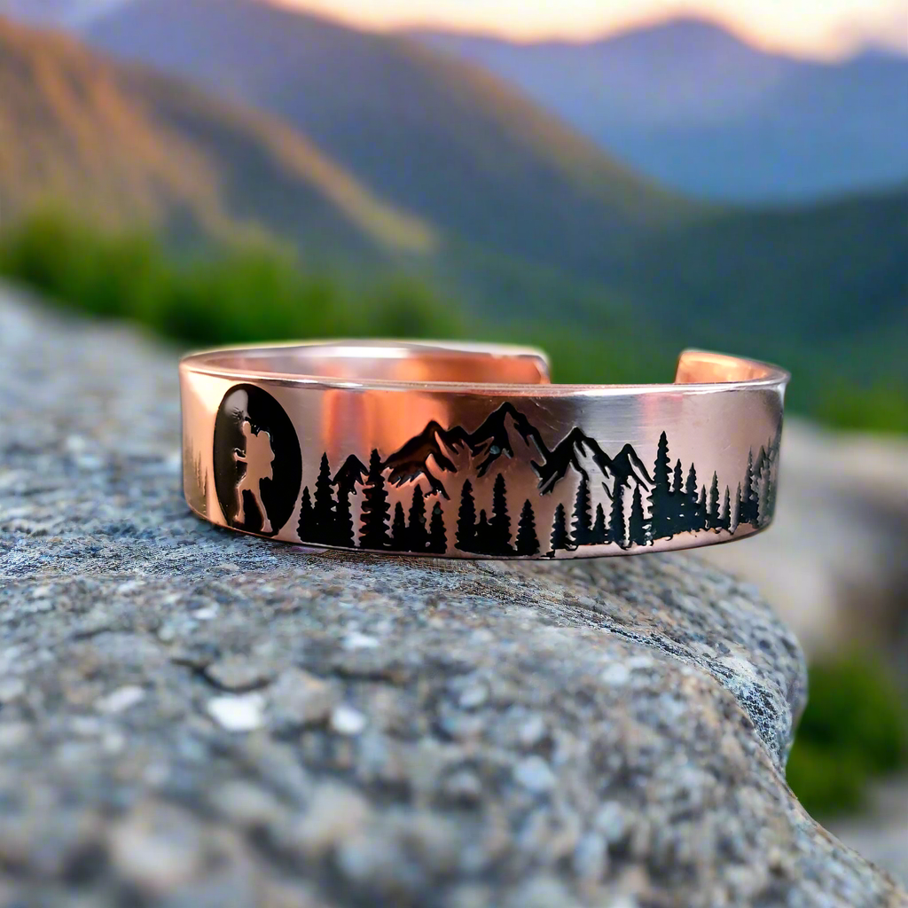 Copper bracelet with nature design on a desk