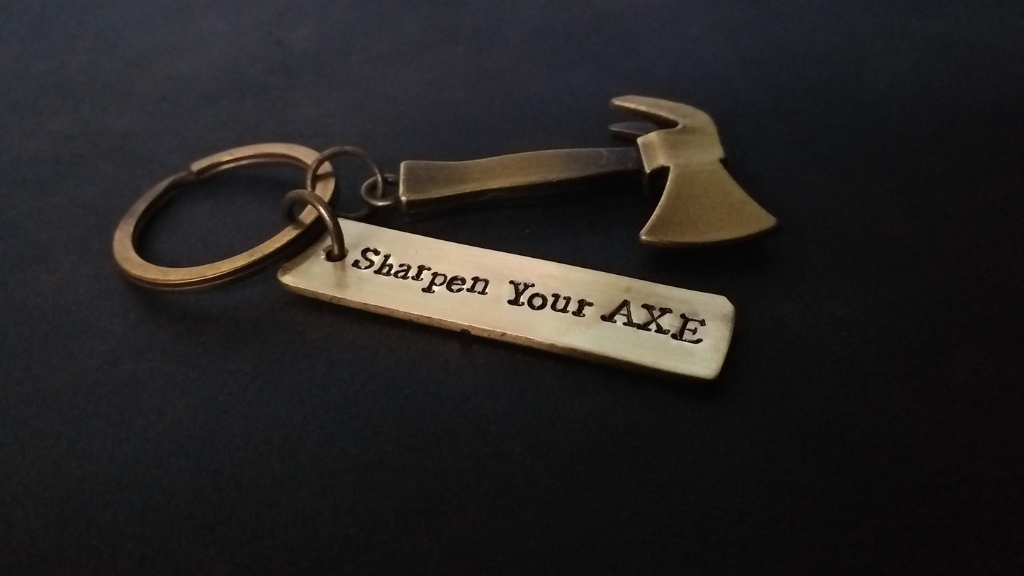 Streetsoul Sharpen Your Axe Keyring with stamped brass tag 2 inches length.