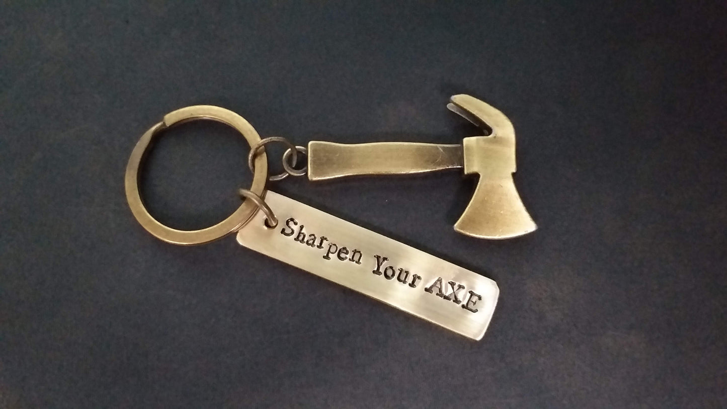 Streetsoul Sharpen Your Axe Keyring with stamped brass tag 2 inches length.