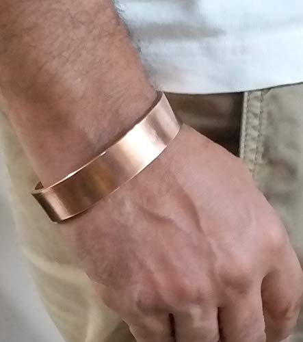 Copper cuff kada bracelet worn on a man's wrist, lifestyle photo