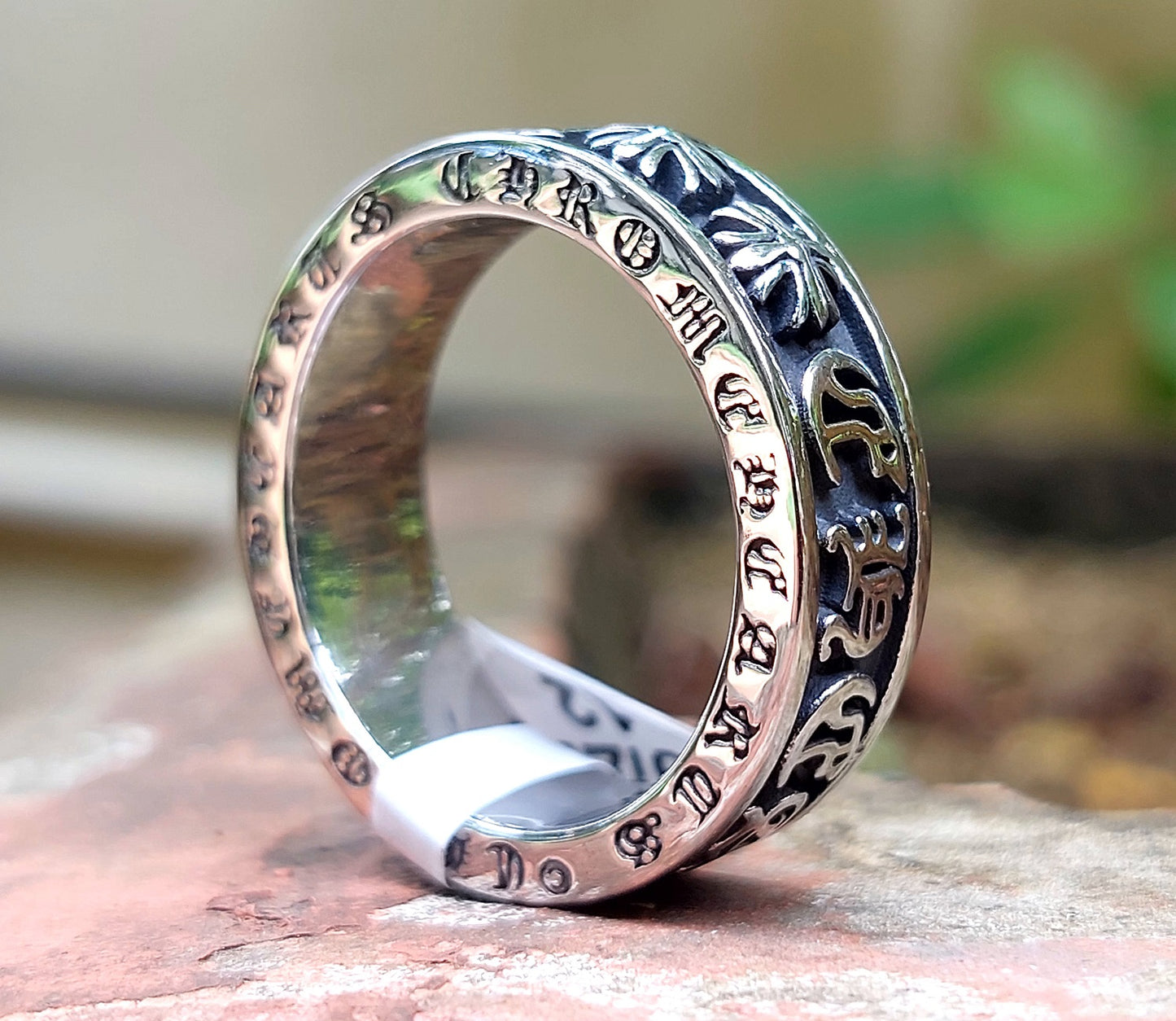 Roman Letters Slim Steel Finger Ring - close up on band