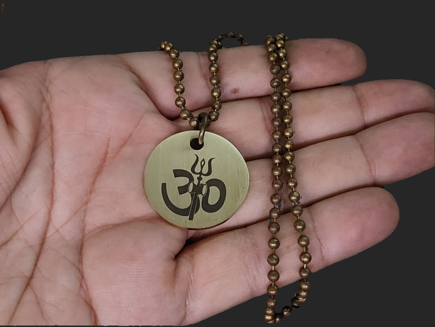 Lord Shiva's Pure Brass Pendant with Om and Mahamrityunjaya mantra engraved.