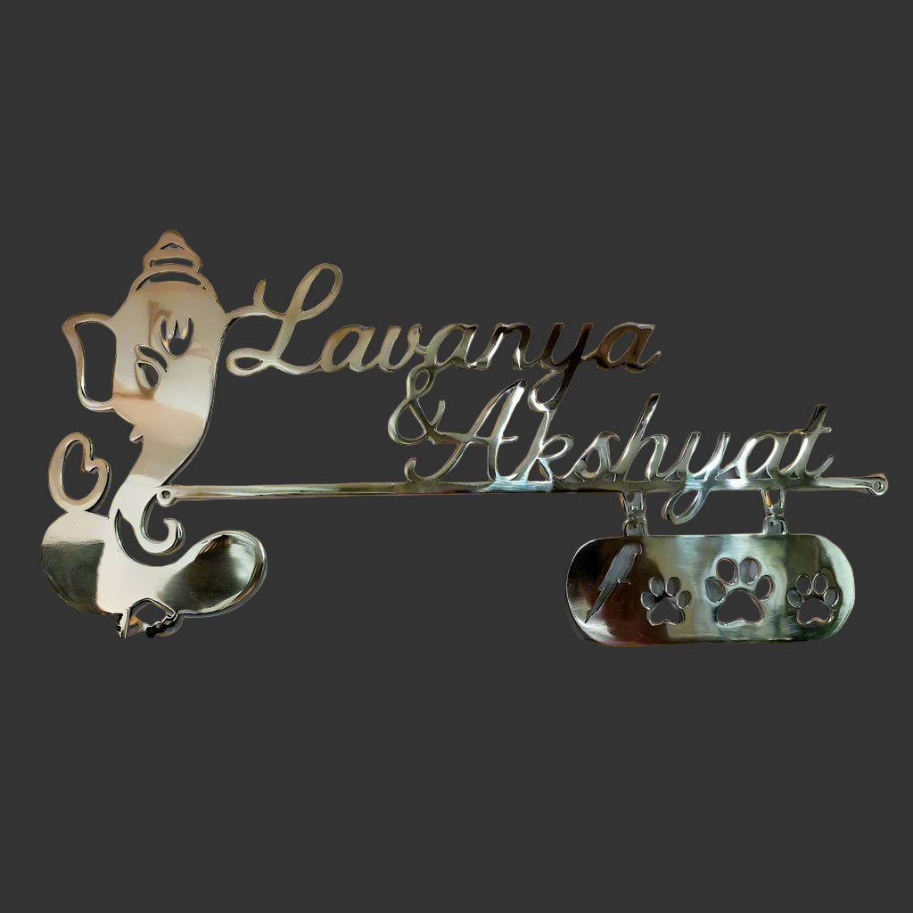 Decorative nameplate with 'Lawanya & Akshyati' on a white background