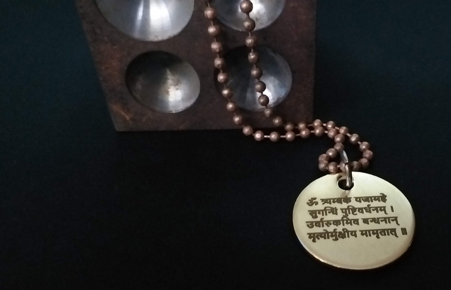 Lord Shiva's Pure Brass Pendant with Om and Mahamrityunjaya mantra engraved.